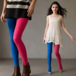 Colorful tights styled with a short skirt and ankle boots
