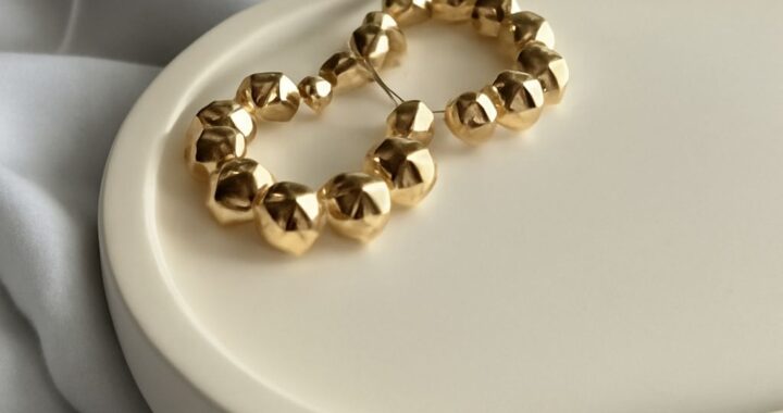 Gold huggie, threader, and bamboo earrings showing different lengths and hoop sizes