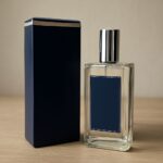 Marshmallow and patchouli fragrance bottles beside scent quiz notes