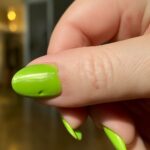 Drugstore nail polish bottles and freshly painted nails