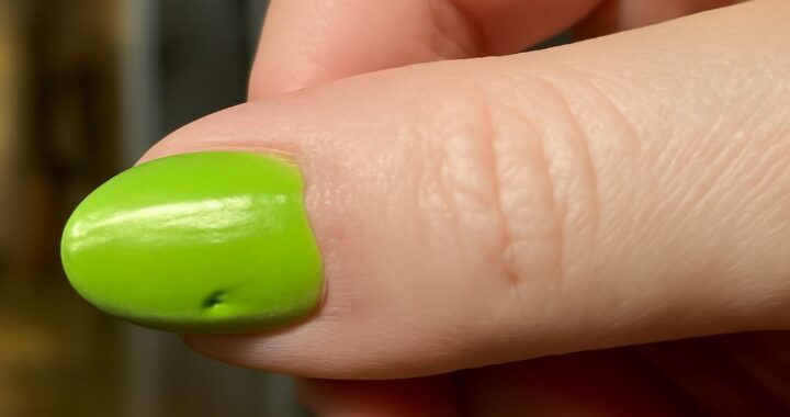 Drugstore nail polish bottles and freshly painted nails