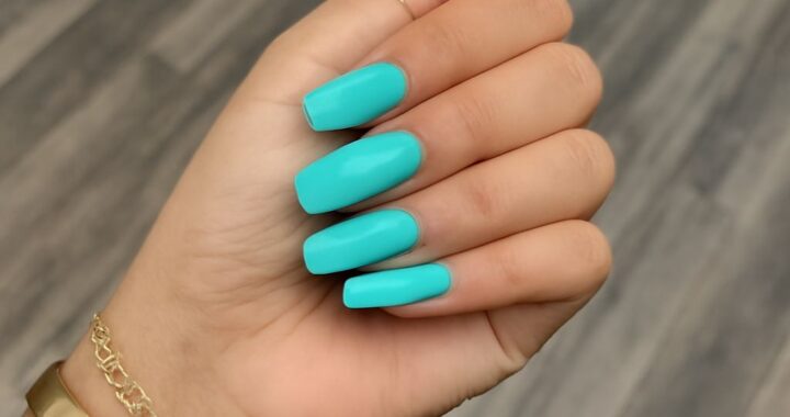Thin coats of nail polish drying on a manicure