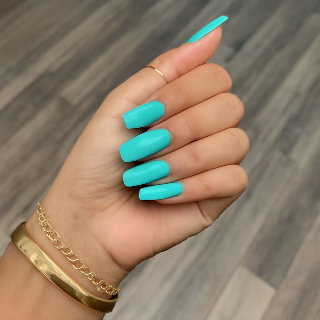 Thin coats of nail polish drying on a manicure