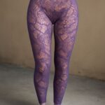 Opaque tights styled with a skirt and ankle boots
