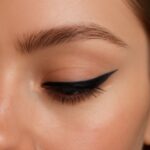 Clean 1960s winged eyeliner with lashes and crease definition