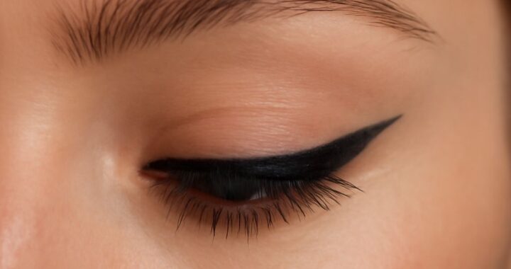 Clean 1960s winged eyeliner with lashes and crease definition
