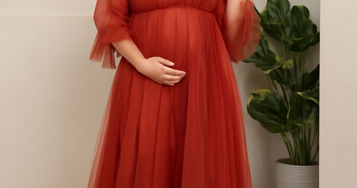 Expecting mother wearing a stylish maternity dress at a baby shower